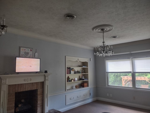 1745 Cedarwood Dr, Milledgeville, GA 31061 - unfurnished dining area with a chandelier, a textured ceiling, ornamental molding, a fireplace, and built in shelves