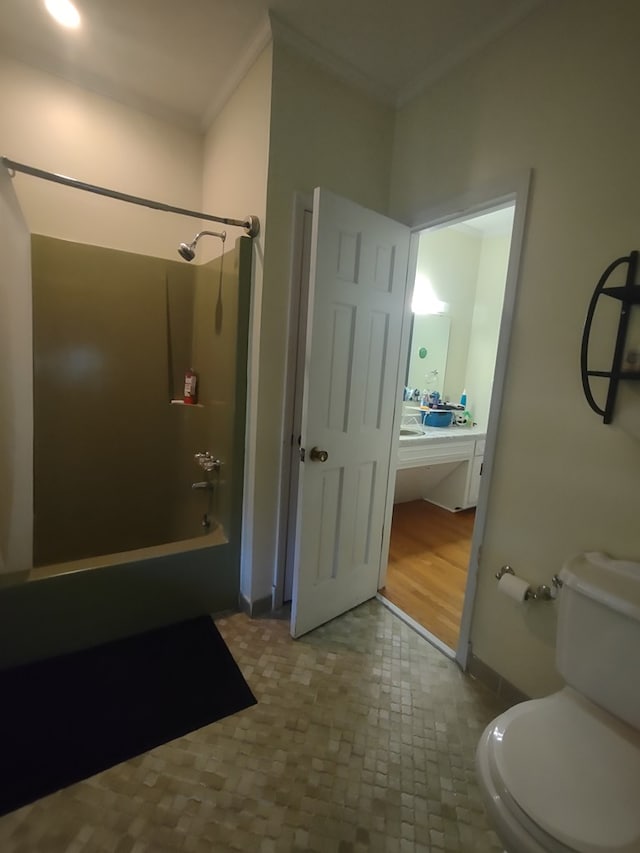 1745 Cedarwood Dr, Milledgeville, GA 31061 - bathroom with crown molding, shower / washtub combination, toilet, and baseboards