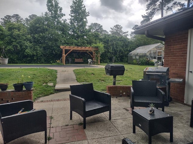 1745 Cedarwood Dr, Milledgeville, GA 31061 - view of patio / terrace featuring a pergola, a greenhouse, and an outdoor hangout area