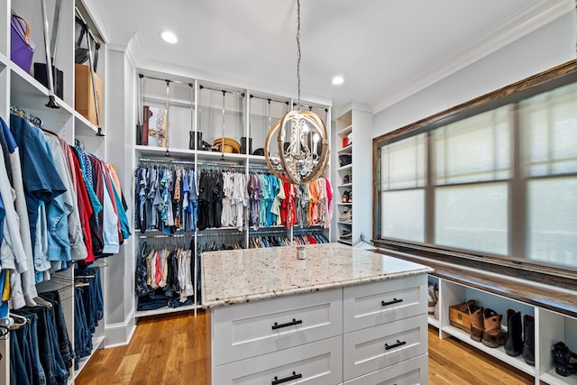 walk in closet featuring light hardwood / wood-style floors