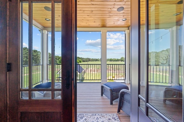 entryway featuring hardwood / wood-style floors and wooden ceiling