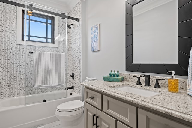 full bathroom featuring crown molding, vanity, enclosed tub / shower combo, and toilet