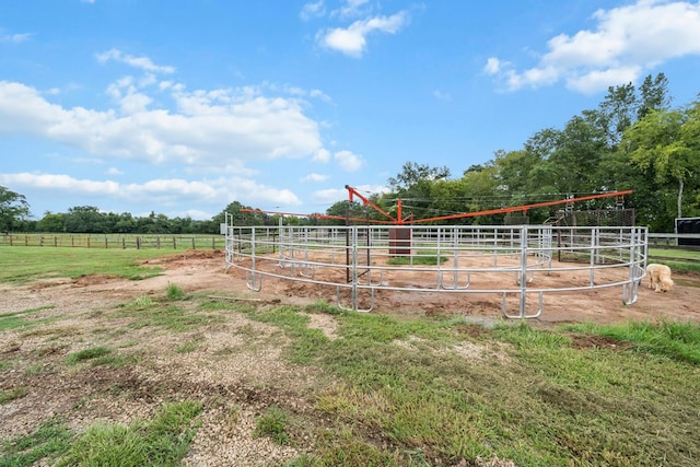 view of stable with a rural view