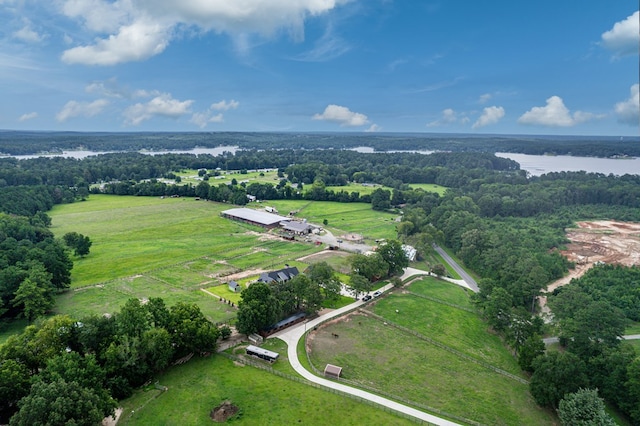 birds eye view of property featuring a rural view and a water view