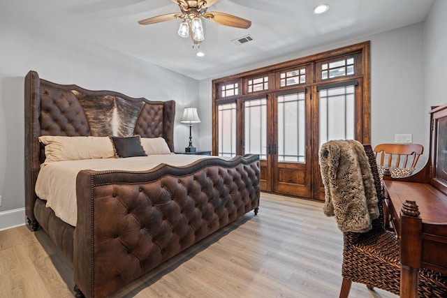 bedroom featuring ceiling fan and light wood-type flooring