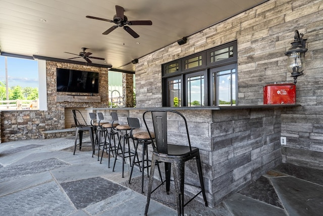 bar with ceiling fan and wooden ceiling