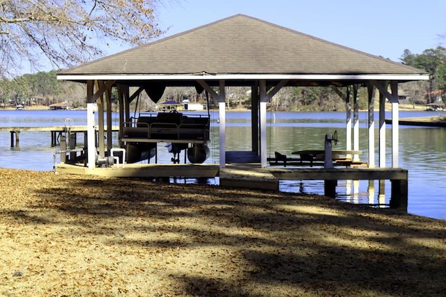 view of dock with a water view and boat lift