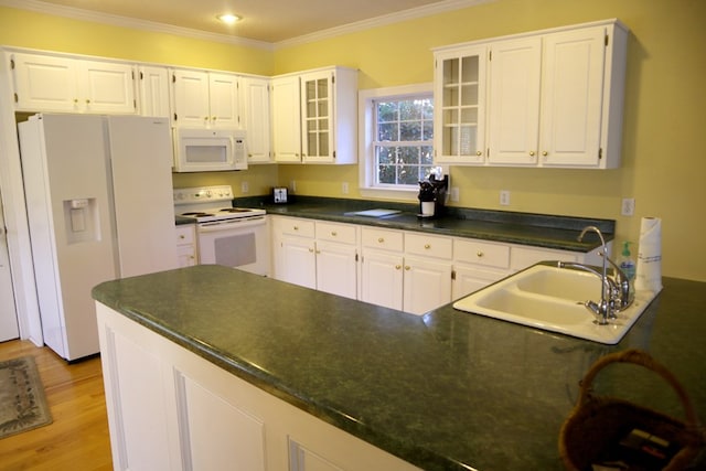 kitchen with white appliances, light hardwood / wood-style floors, crown molding, white cabinets, and sink