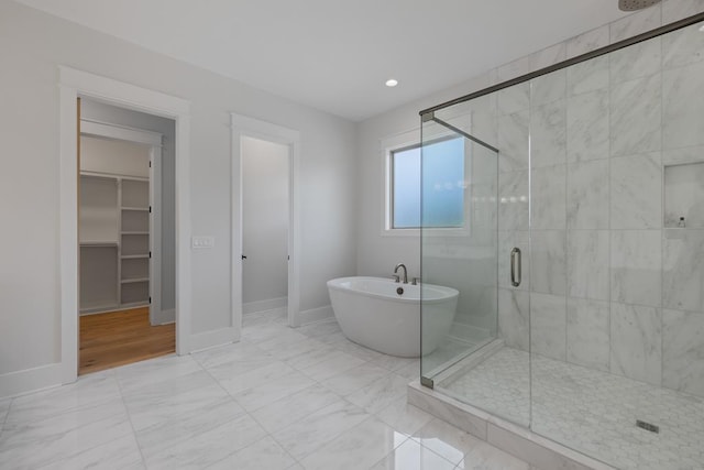 bathroom with shower with separate bathtub