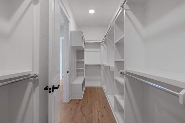 spacious closet featuring light wood-type flooring