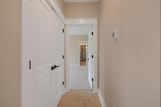 hallway featuring light wood-type flooring