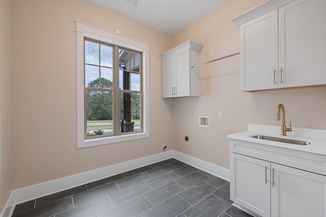 laundry area with cabinets, sink, washer hookup, and hookup for an electric dryer