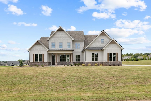 craftsman inspired home with a front lawn