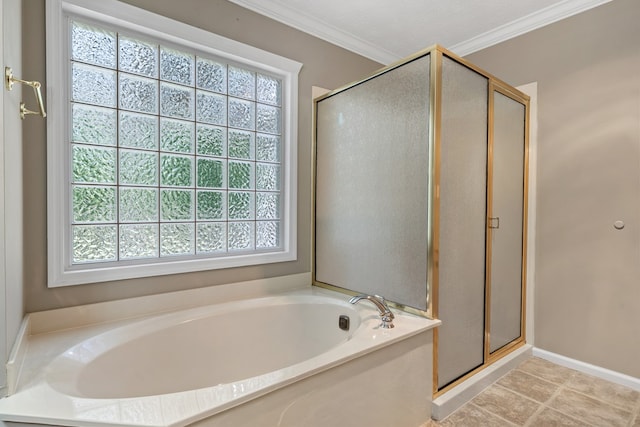 bathroom featuring ornamental molding, a bath, and a shower stall