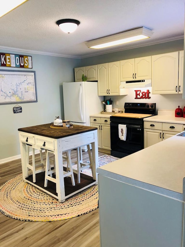 kitchen with a textured ceiling, crown molding, electric range, white refrigerator, and white cabinets