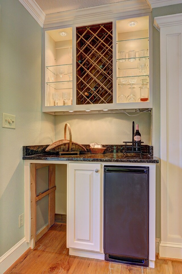 136 Kings Rd, Milledgeville, GA 31061 - indoor wet bar with fridge, ornamental molding, and light wood finished floors