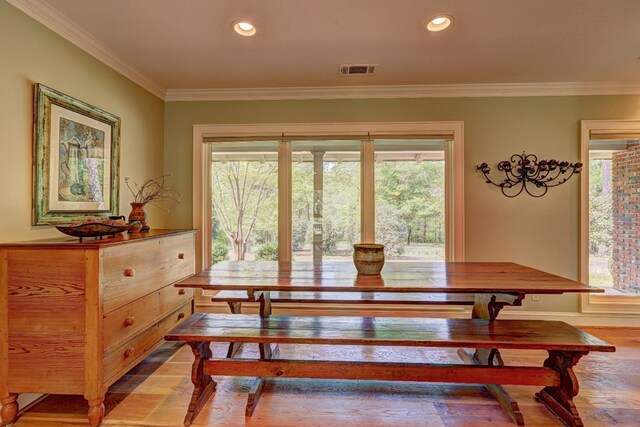 136 Kings Rd, Milledgeville, GA 31061 - dining room with wood finished floors, crown molding, healthy amount of natural light, and recessed lighting