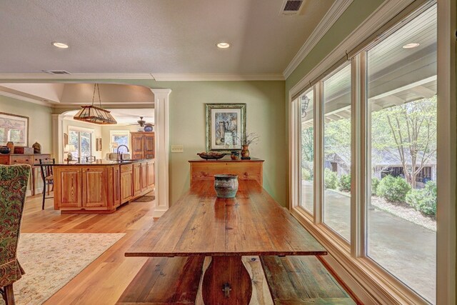 136 Kings Rd, Milledgeville, GA 31061 - dining room with light wood-type flooring, crown molding, and recessed lighting