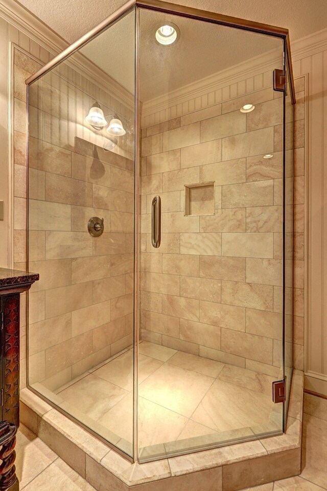 136 Kings Rd, Milledgeville, GA 31061 - bathroom featuring crown molding, a shower stall, tile patterned floors, and recessed lighting