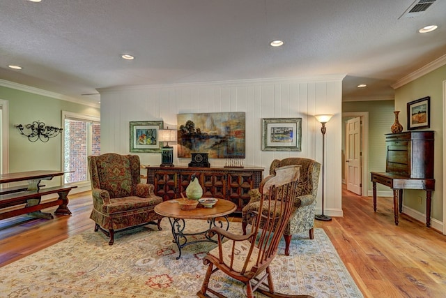 136 Kings Rd, Milledgeville, GA 31061 - living area featuring crown molding, wood finished floors, recessed lighting, and a textured ceiling