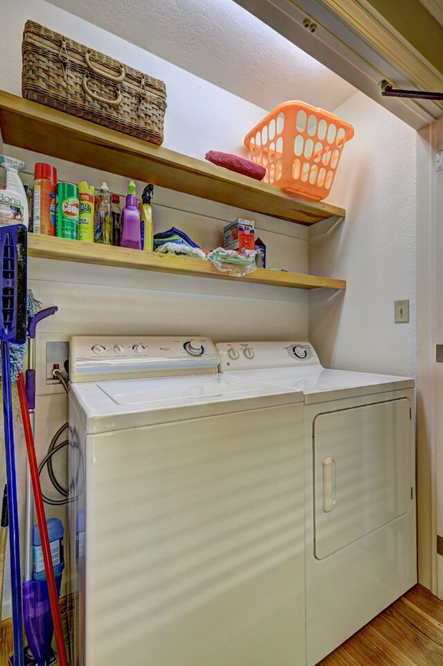 136 Kings Rd, Milledgeville, GA 31061 - washroom with washing machine and dryer and wood finished floors