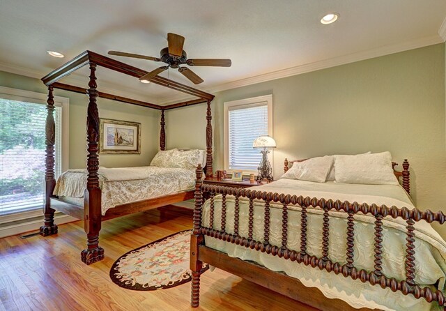 136 Kings Rd, Milledgeville, GA 31061 - bedroom with crown molding, multiple windows, wood finished floors, a ceiling fan, and recessed lighting