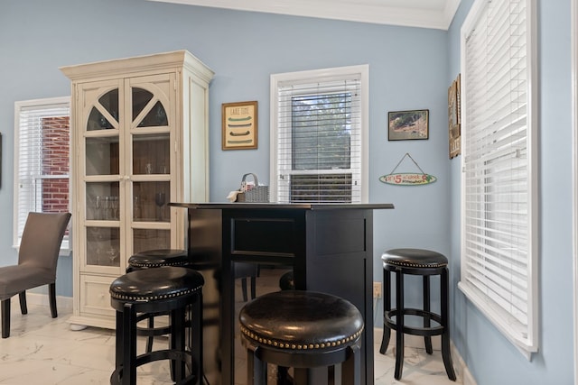 2122 Harbour Point Dr, Sparta, GA 31087 - bar area with light marble finish flooring, ornamental molding, and baseboards