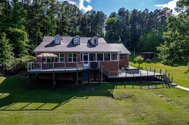 2122 Harbour Point Dr, Sparta, GA 31087 - rear view of property featuring brick siding, a deck, stairway, and a yard