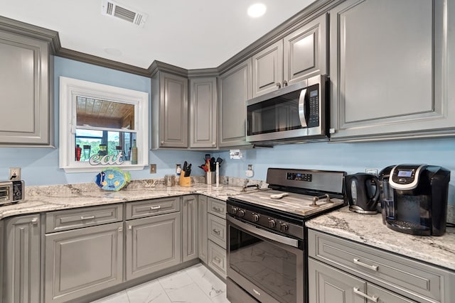2122 Harbour Point Dr, Sparta, GA 31087 - kitchen with appliances with stainless steel finishes, gray cabinets, light marble finish floors, and light stone counters