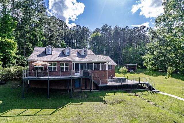 2122 Harbour Point Dr, Sparta, GA 31087 - back of house with brick siding, a wooden deck, stairway, a sunroom, and a yard