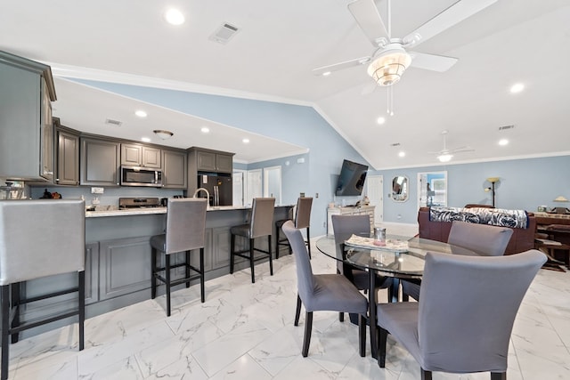 2122 Harbour Point Dr, Sparta, GA 31087 - dining space with ornamental molding, light marble finish floors, ceiling fan, recessed lighting, and lofted ceiling