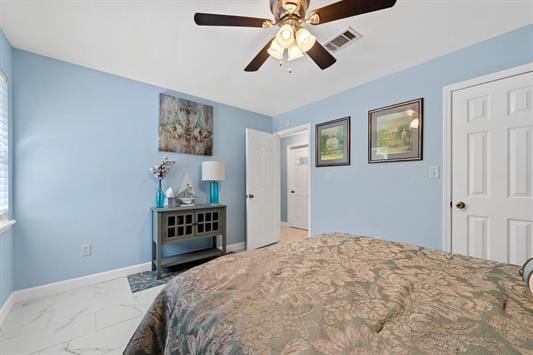 2122 Harbour Point Dr, Sparta, GA 31087 - bedroom with marble look tile flooring, baseboards, and a ceiling fan