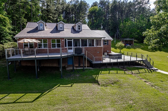 2122 Harbour Point Dr, Sparta, GA 31087 - rear view of property featuring brick siding, stairs, a wooden deck, a yard, and view of wooded area