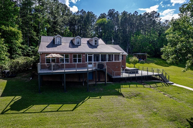 2122 Harbour Point Dr, Sparta, GA 31087 - back of property featuring brick siding, a deck, stairway, and a yard