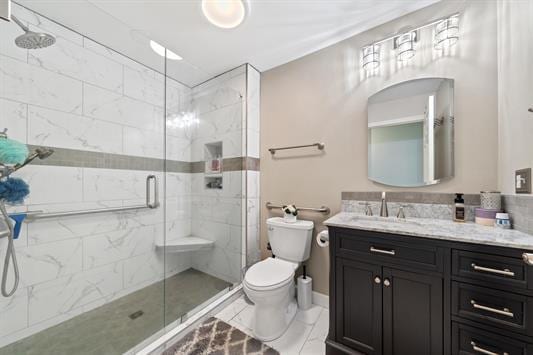 2122 Harbour Point Dr, Sparta, GA 31087 - bathroom featuring toilet, a stall shower, marble look tiles, and vanity