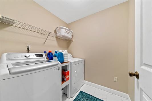 2122 Harbour Point Dr, Sparta, GA 31087 - laundry area with independent washer and dryer, baseboards, and tile patterned flooring