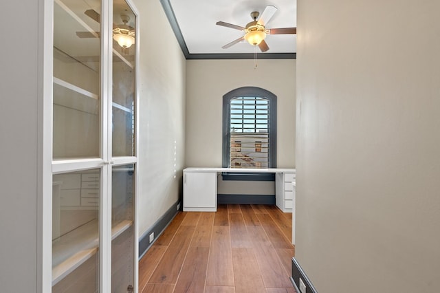 hall featuring crown molding and wood-type flooring