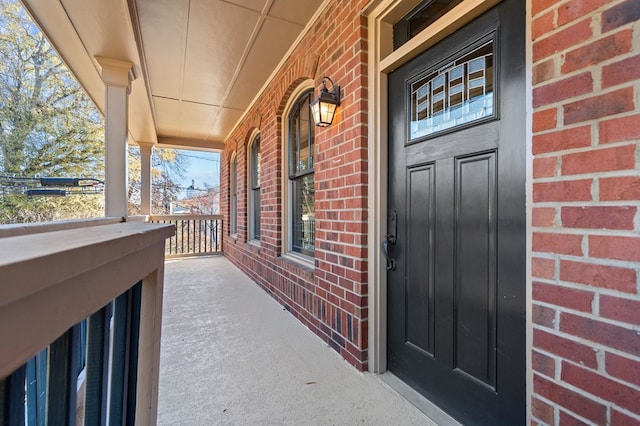 doorway to property featuring covered porch