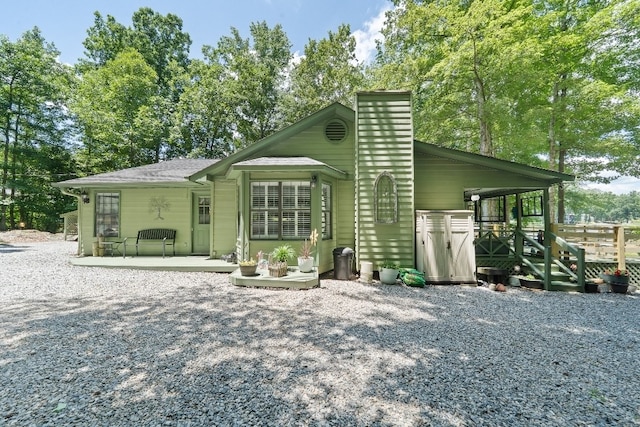 102 E Montego Ct, Milledgeville, GA 31061 - view of front of home featuring a chimney and a patio