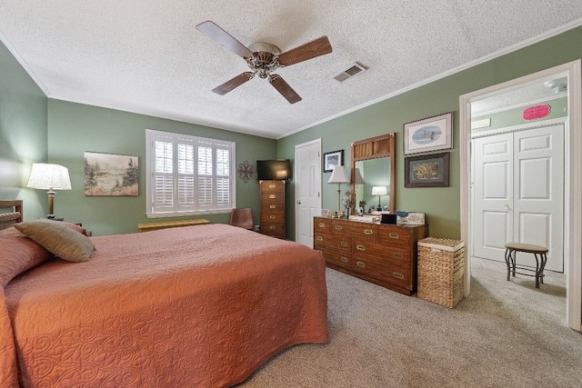 102 E Montego Ct, Milledgeville, GA 31061 - carpeted bedroom with a textured ceiling, crown molding, and ceiling fan