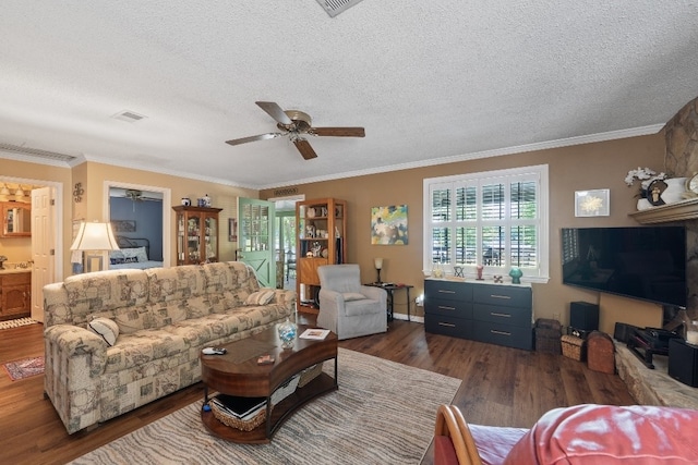 102 E Montego Ct, Milledgeville, GA 31061 - living area with dark wood-style flooring, ceiling fan, a textured ceiling, and crown molding