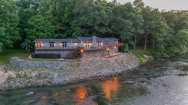 back of property featuring a deck