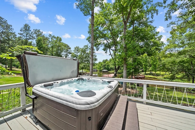 wooden deck featuring a hot tub