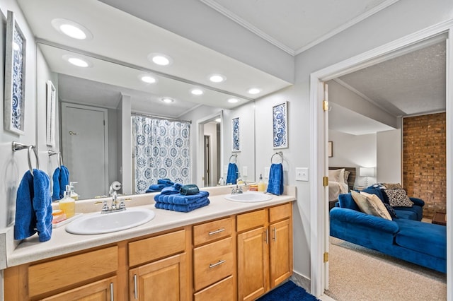 bathroom with vanity and ornamental molding