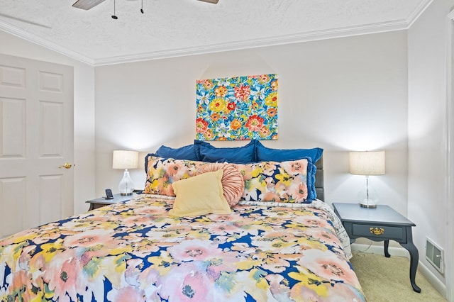 carpeted bedroom featuring ceiling fan, ornamental molding, vaulted ceiling, and a textured ceiling