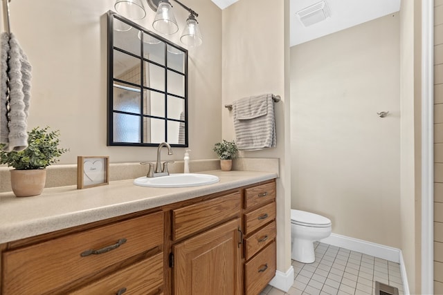 bathroom featuring visible vents, toilet, tile patterned flooring, and vanity