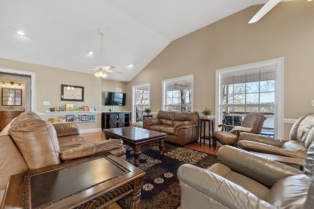 living area with wood finished floors, recessed lighting, a ceiling fan, and lofted ceiling
