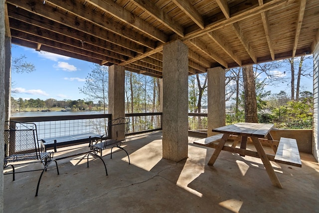 view of patio / terrace with a water view and outdoor dining area