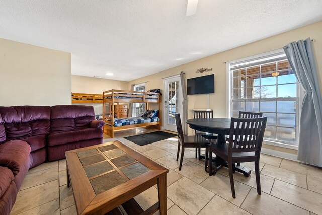 living area featuring a textured ceiling