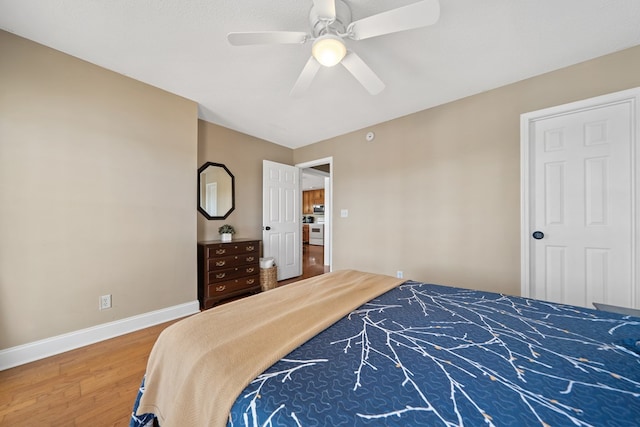 bedroom featuring ceiling fan, baseboards, and wood finished floors